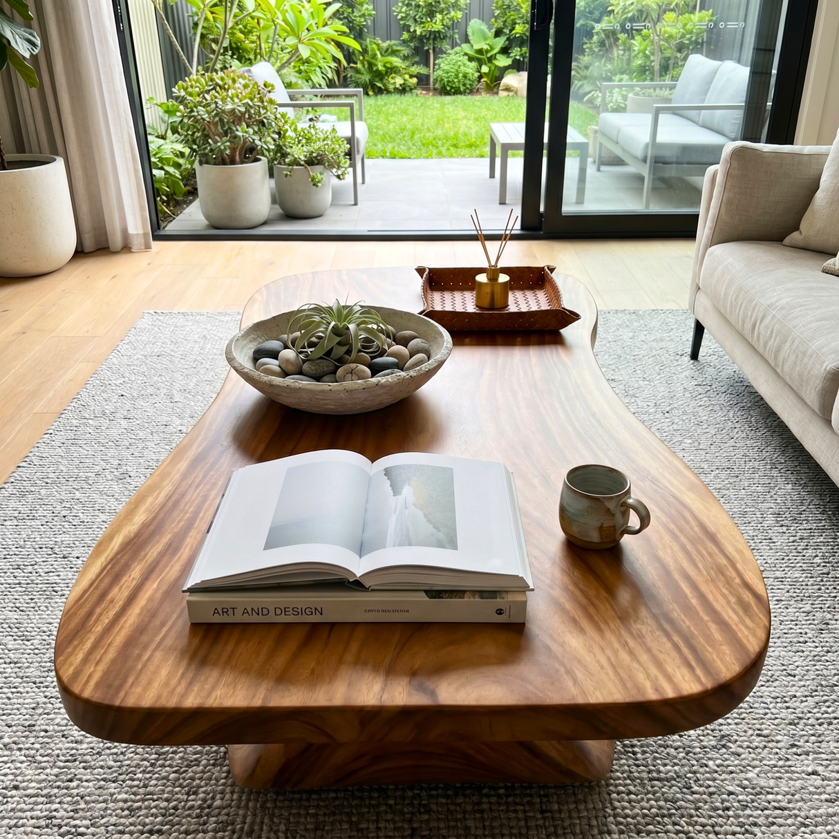 Rustic Solid Wood Coffee Table with Flowing Carved Base and Rounded Edge Top