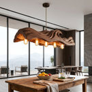 The Handcrafted Organic Wood Pendant Light with Wave Carved Form and Exposed Bulbs