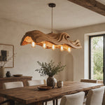 The Handcrafted Organic Wood Pendant Light with Wave Carved Form and Exposed Bulbs